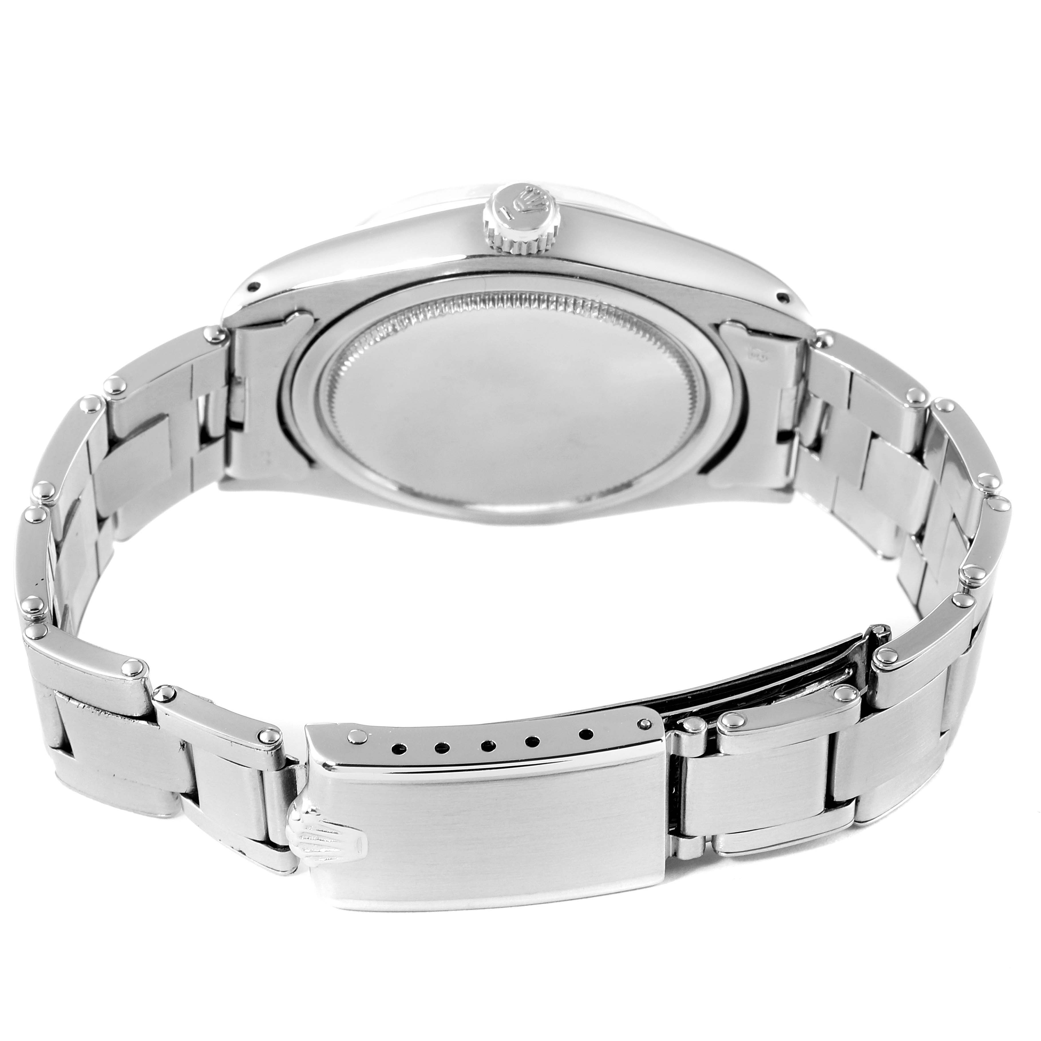 The image shows the back view, bracelet, and clasp of a Vintage Collection model by Rolex.