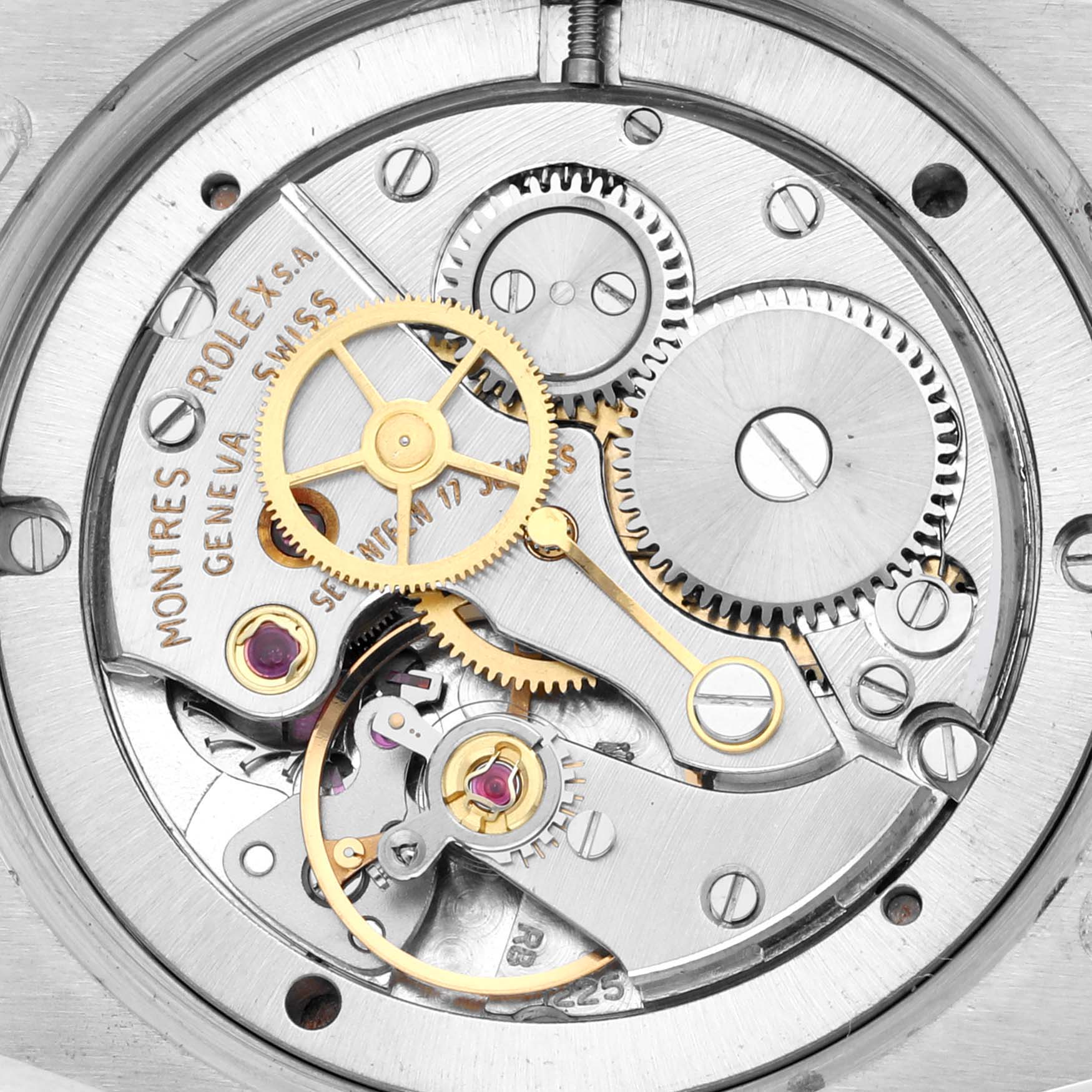 This image shows a close-up view of the internal movement of the Vintage Collection model by Rolex, highlighting gears and mechanical components.