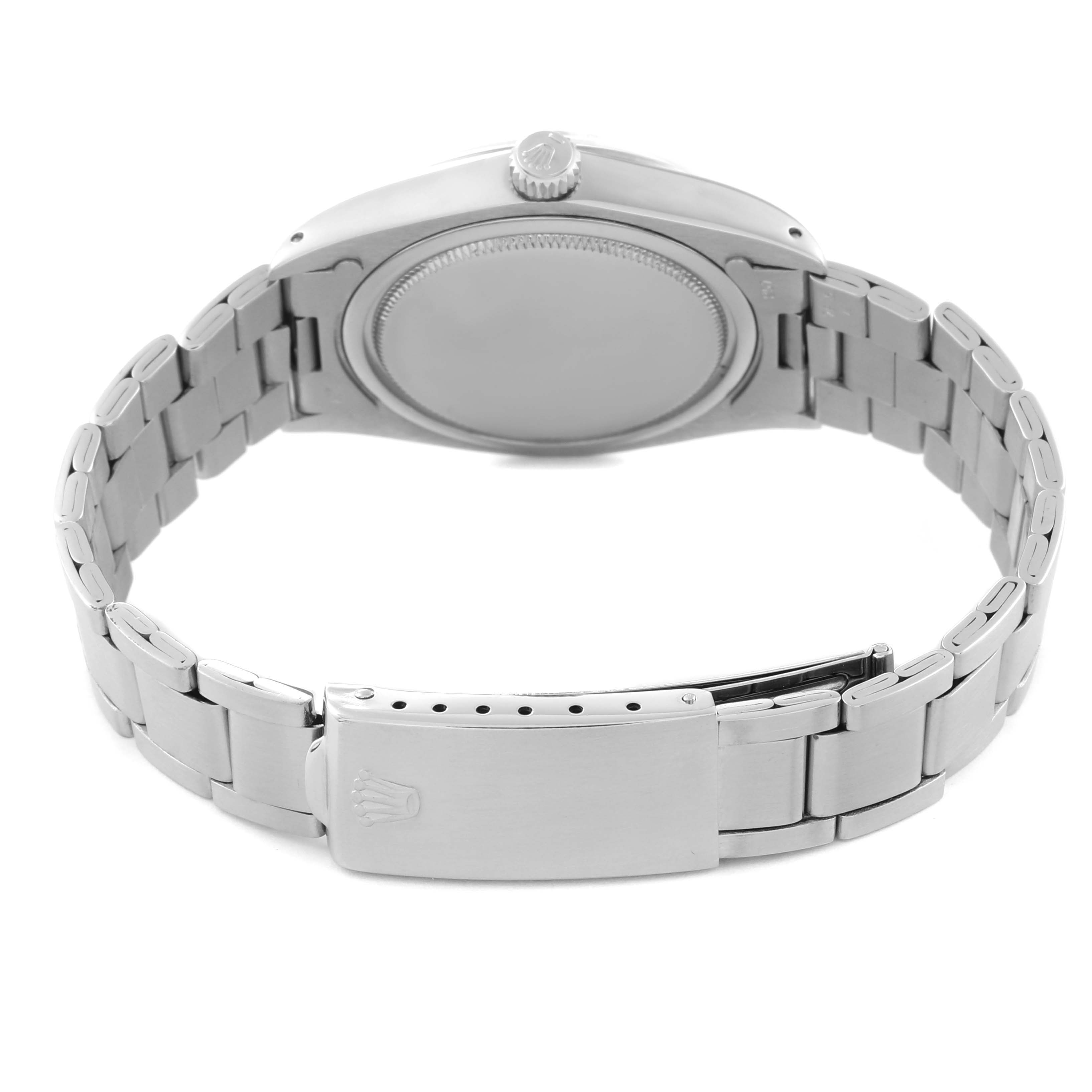 The image shows the backside of the Rolex Vintage Collection 6694 Men's Stainless Steel Silver Dial 6694 Men's Stainless Steel Silver Dial model, displaying its case back, crown, and metal bracelet with clasp.