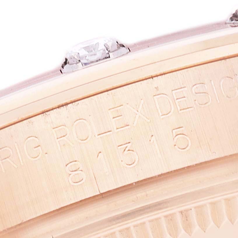 This is a close-up of the side of a Rolex Pearlmaster 81315 Women's Rose Gold Mother of Pearl Dial 81315 Women's Rose Gold Mother of Pearl Dial watch showing the serial number and part of the bezel.