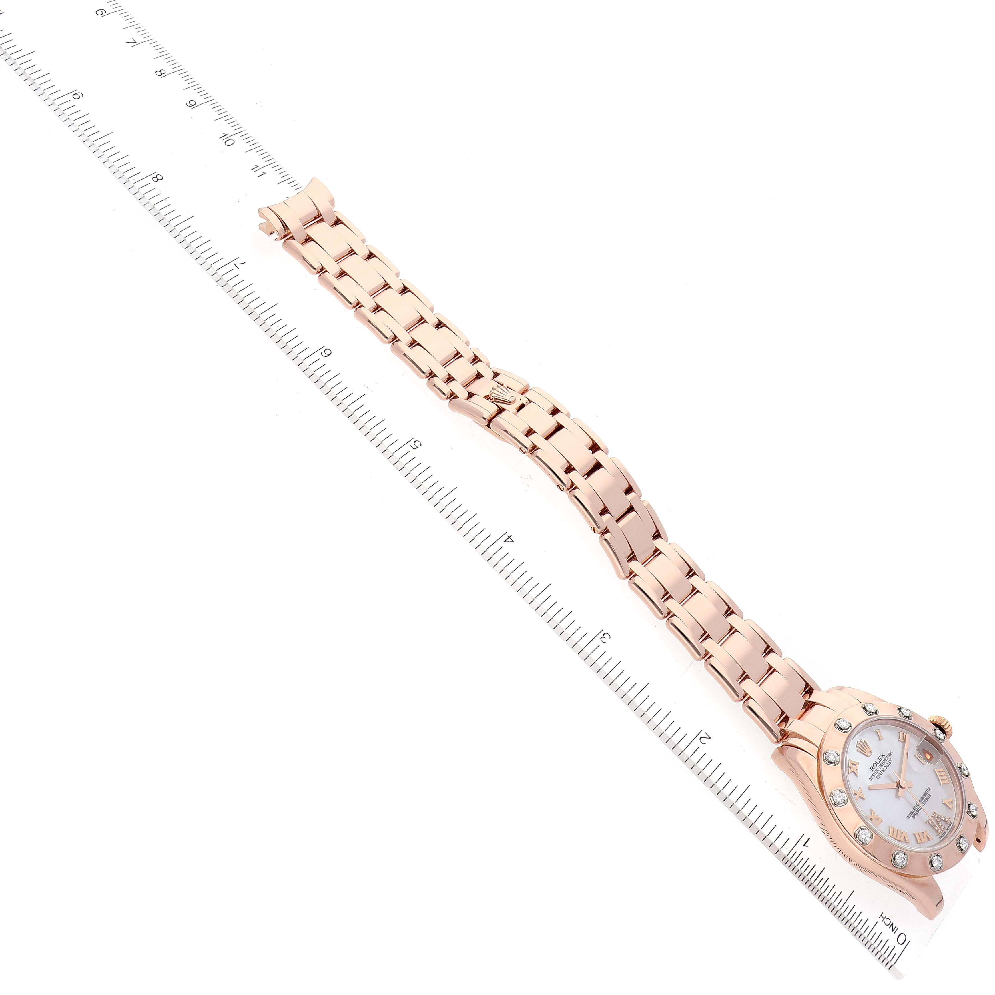 The image shows a Rolex Pearlmaster 81315 Women's Rose Gold Mother of Pearl Dial 81315 Women's Rose Gold Mother of Pearl Dial watch laid flat with a ruler measuring its length from a top-down angle.