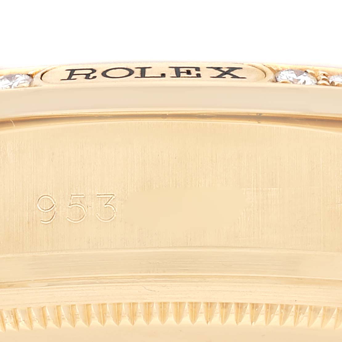 This image shows a close-up of the side and edge of a Rolex President 18138 Men's Yellow Gold Black Dial 18138 Men's Yellow Gold Black Dial model watch, highlighting the bezel and part of the case.