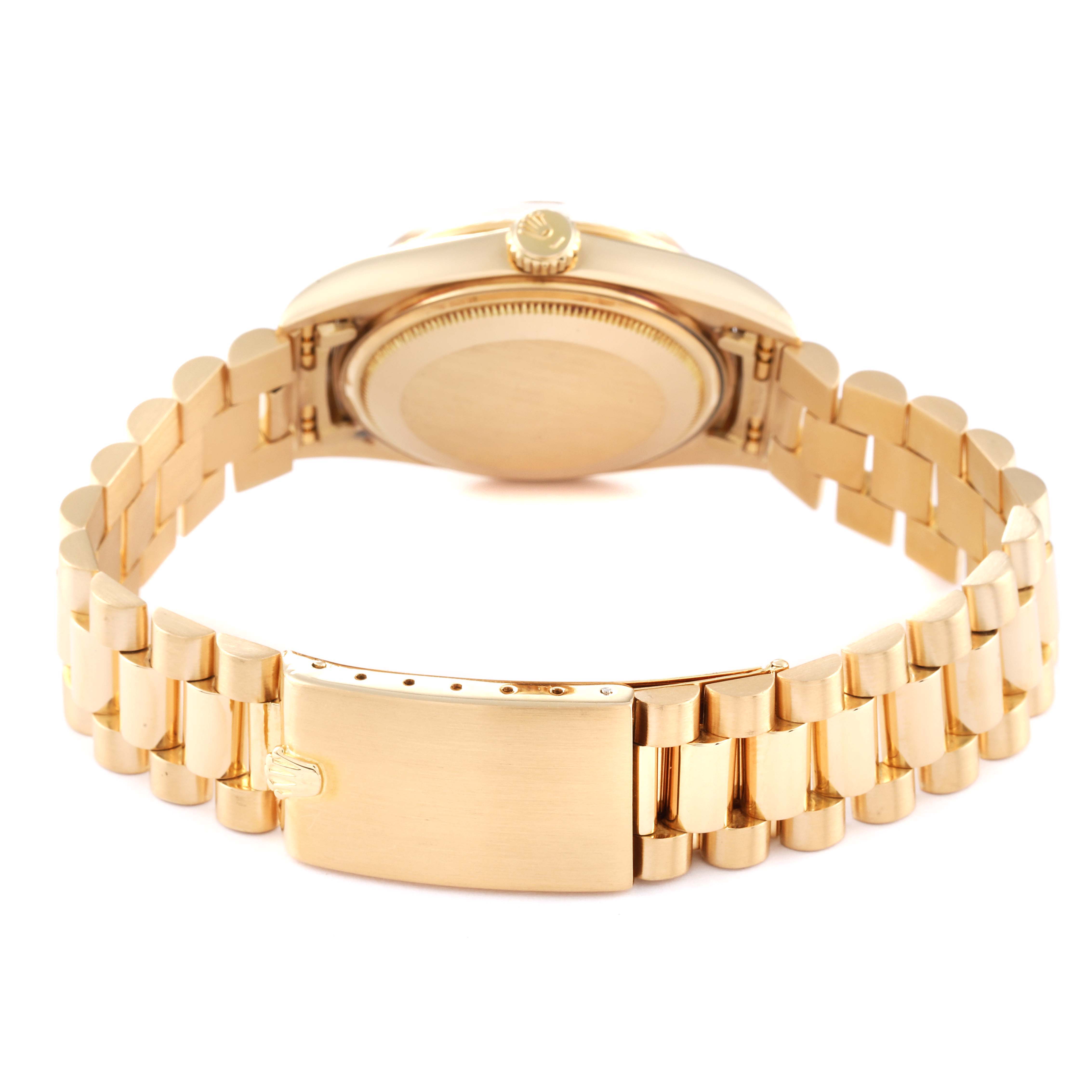 The photo shows the back view of the Rolex Vintage Collection 1803 Men's Yellow Gold Champagne Dial 1803 Men's Yellow Gold Champagne Dial watch, highlighting its case back and gold bracelet.