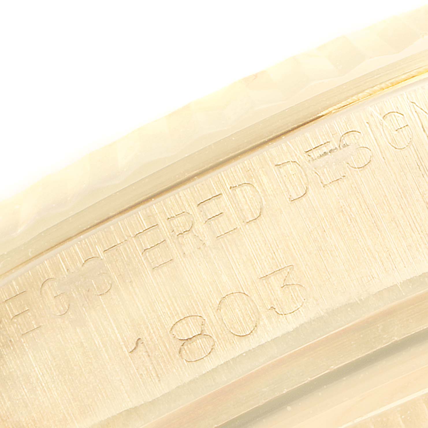 This close-up image shows the engraved model number on the side of a Rolex Vintage Collection 1803 Men's Yellow Gold Champagne Dial 1803 Men's Yellow Gold Champagne Dial watch case.