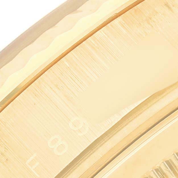 This image shows a close-up angle of the bezel and partial dial of the Rolex President 118238 Men
s Yellow Gold Mother of Pearl Dial 118238 Men
s Yellow Gold Mother of Pearl Dial model watch.