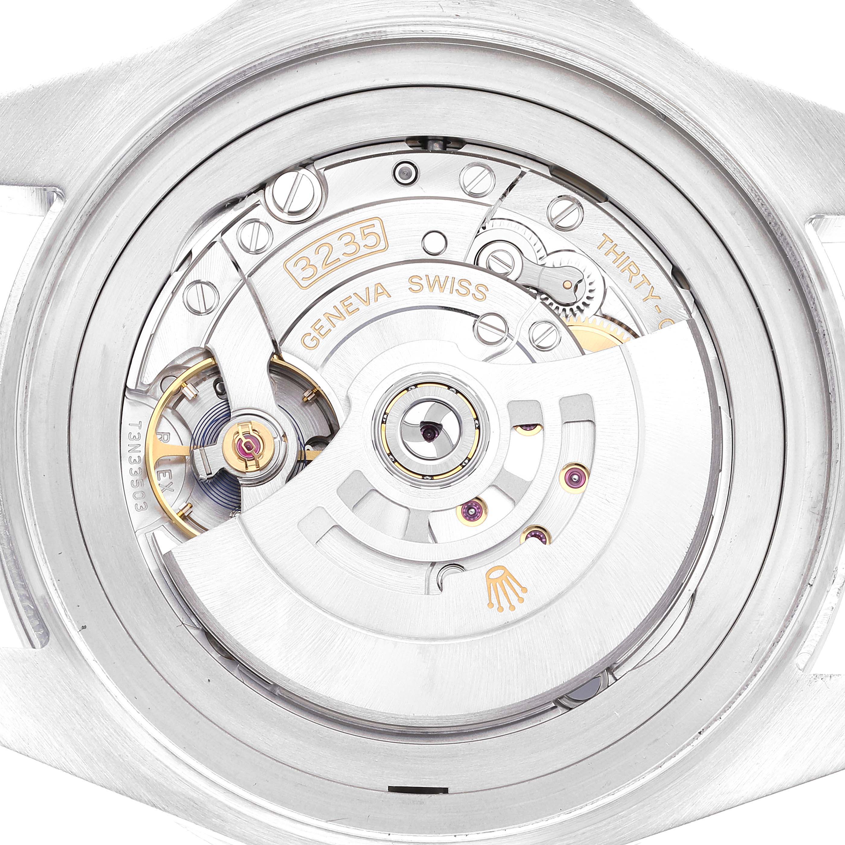 The image shows the movement of the Rolex Sea-Dweller model 126660 from the back, highlighting the intricate gears and the rotor marked with "3235" and "Geneva Swiss."