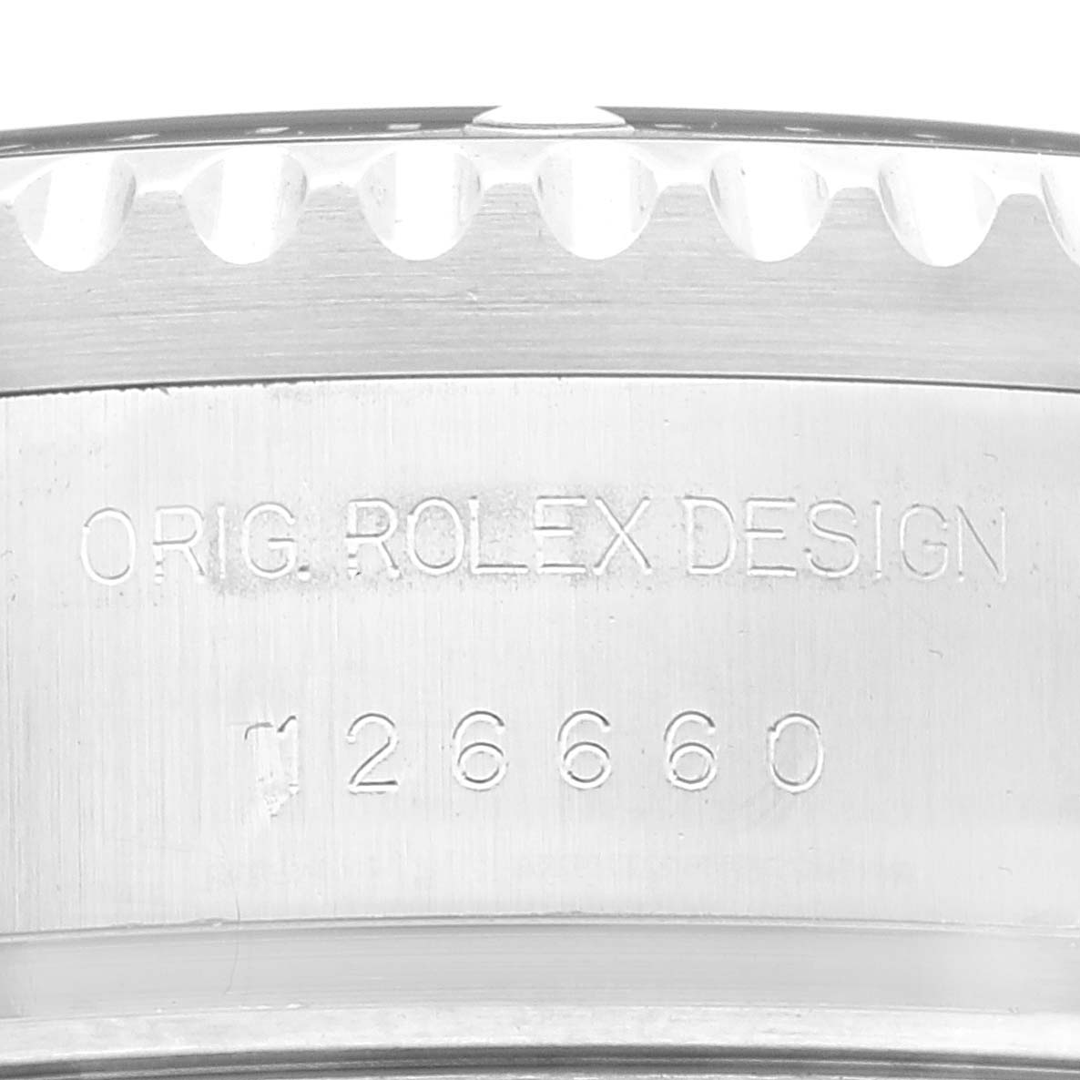 The image shows a close-up of the side of the Rolex Sea-Dweller model 126660, highlighting the engraved "ORIG. ROLEX DESIGN" and model number.