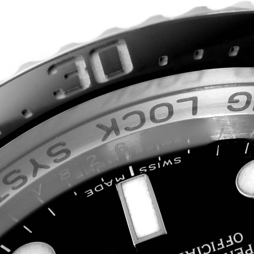 This close-up angle of the Rolex Sea-Dweller 116660 Men
s Stainless Steel Black Dial 116660 Men
s Stainless Steel Black Dial watch shows the bezel, part of the dial, and the "SWISS MADE" marking.