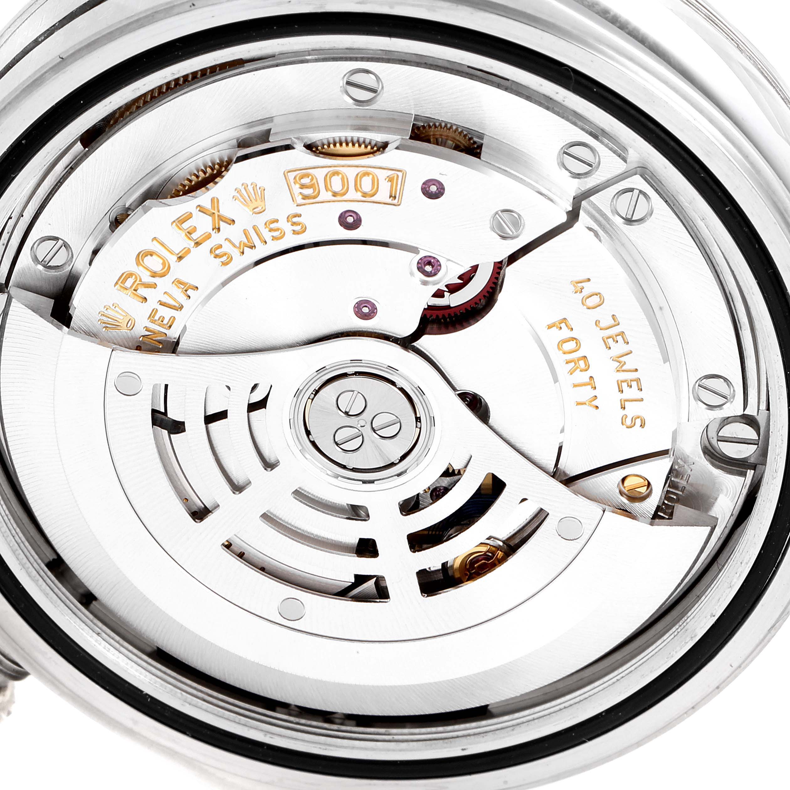 This image shows the detailed internal mechanism of the Rolex Sky-Dweller 326934 Men's Stainless Steel White Dial 326934 Men's Stainless Steel White Dial watch, including parts of the movement and engravings.