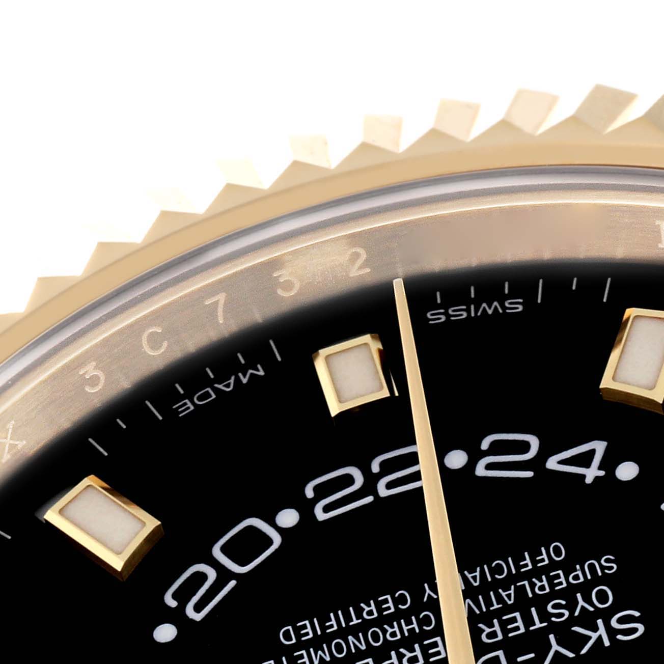 Close-up angle of the Rolex Sky-Dweller 326238 Men's Yellow Gold Black Dial 326238 Men's Yellow Gold Black Dial showing the upper portion of the dial, part of the bezel, and time indices.