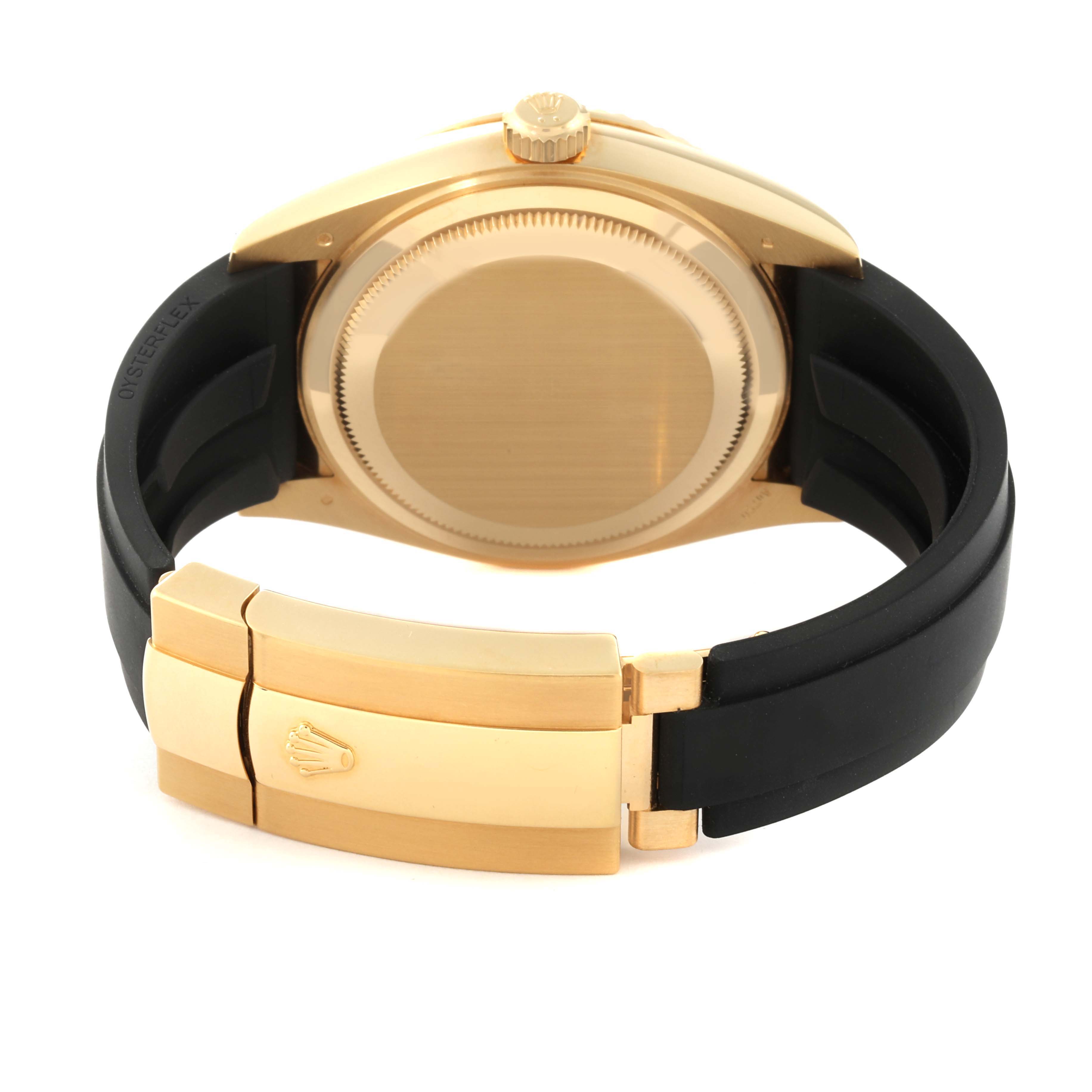 This image shows the back view of the Rolex Sky-Dweller 326238 Men's Yellow Gold Black Dial 326238 Men's Yellow Gold Black Dial watch, featuring its case back, crown, and the clasp of its strap.