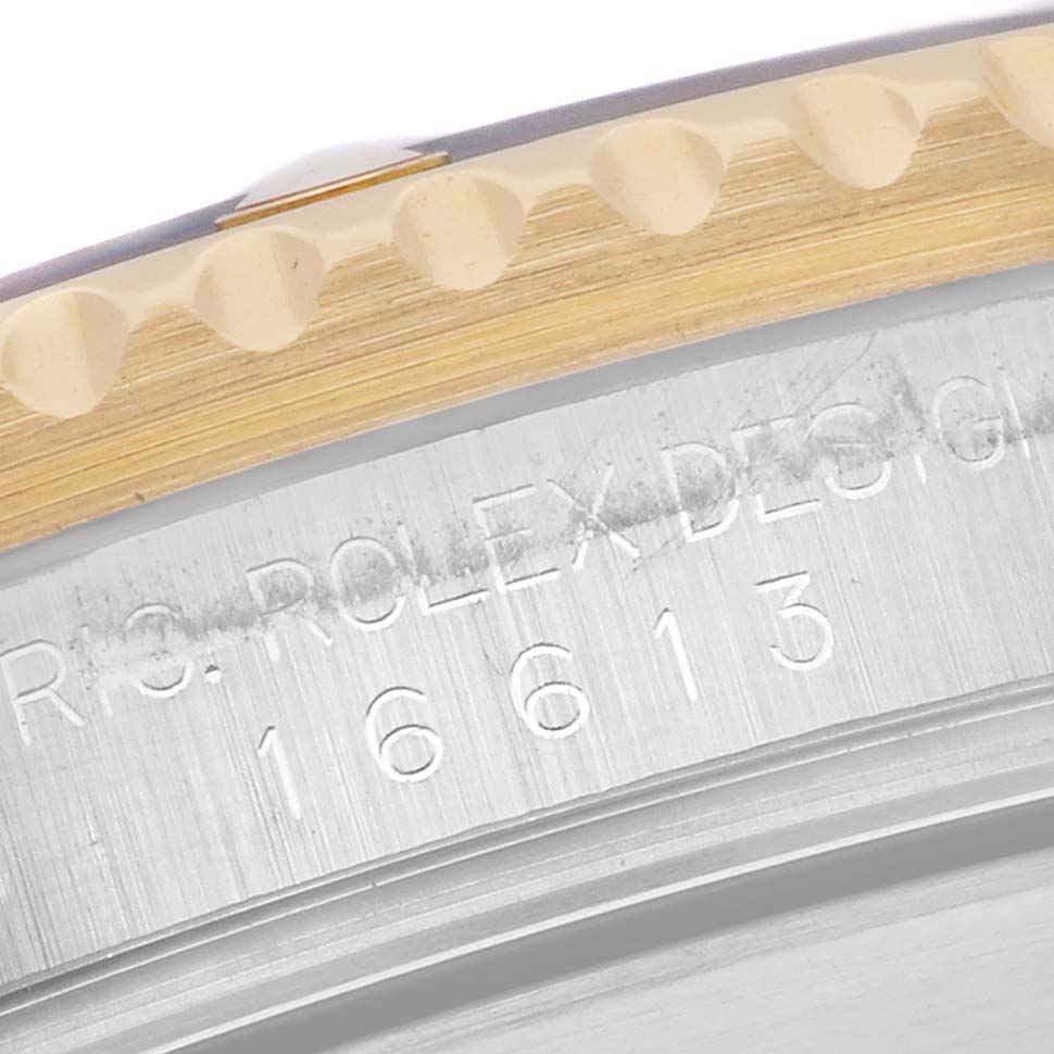 The image shows a close-up angle of the case edge and bezel of a Rolex Submariner 16613 Men's Steel and Gold (two tone) Blue Dial 16613 Men's Steel and Gold (two tone) Blue Dial model 16613.