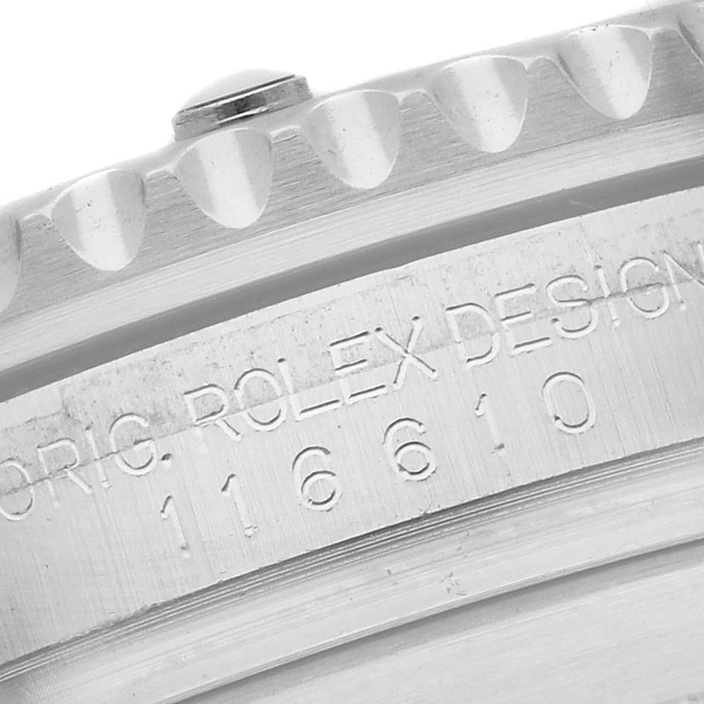 The image shows a close-up of the side of a Rolex Submariner 116610LV Men's Stainless Steel Green Dial 116610LV Men's Stainless Steel Green Dial watch, highlighting the engraved model number and the edge of the bezel.
