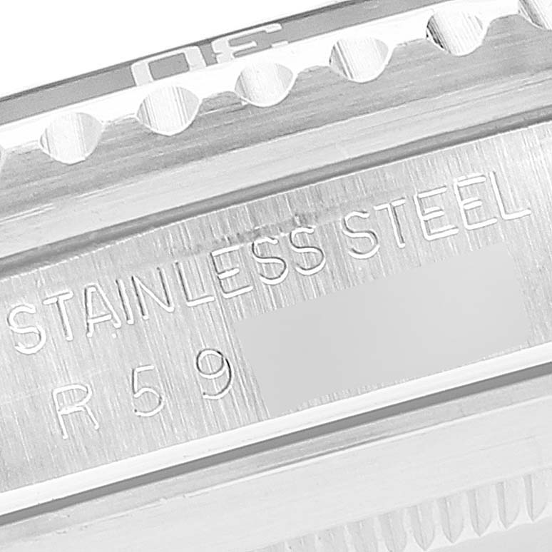 The image shows a close-up of the side of a Rolex Submariner 168000 Men
s Stainless Steel Black Dial 168000 Men
s Stainless Steel Black Dial watch, highlighting part of the bezel and the "Stainless Steel" engraving.