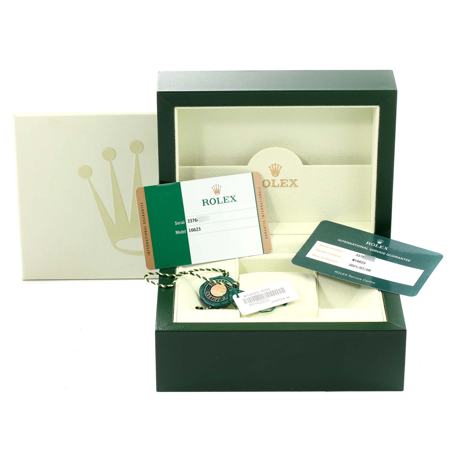 The image shows an open Rolex box with warranty cards and a tag for the Yacht-Master model, viewed from the front.