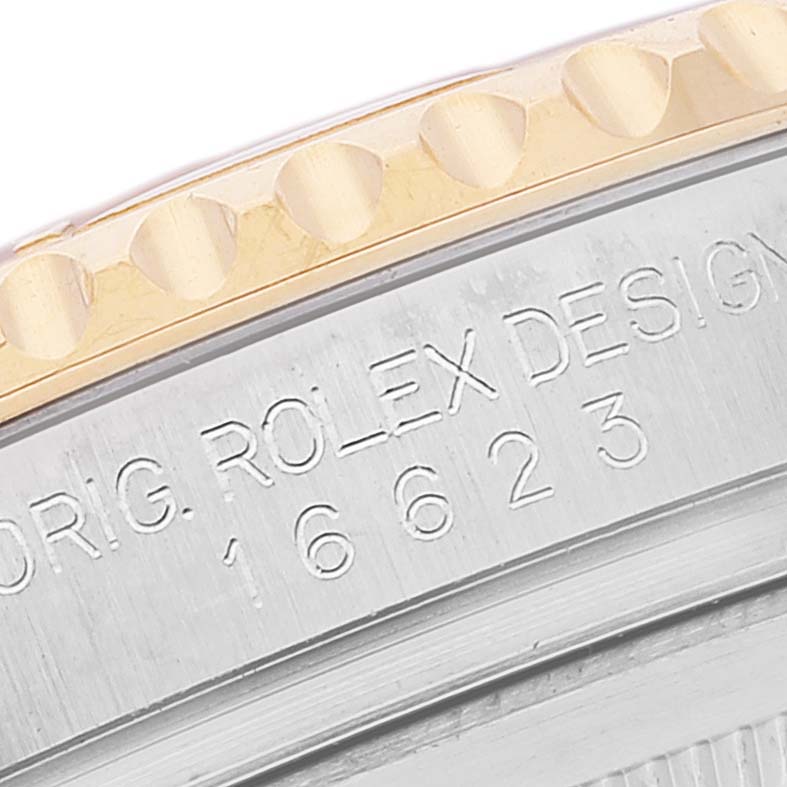 This close-up angle shows the engraved model number "16623" and the partially visible bezel of the Rolex Yacht-Master 16623 Men
s Steel and Gold (two tone) White Dial 16623 Men
s Steel and Gold (two tone) White Dial watch.
