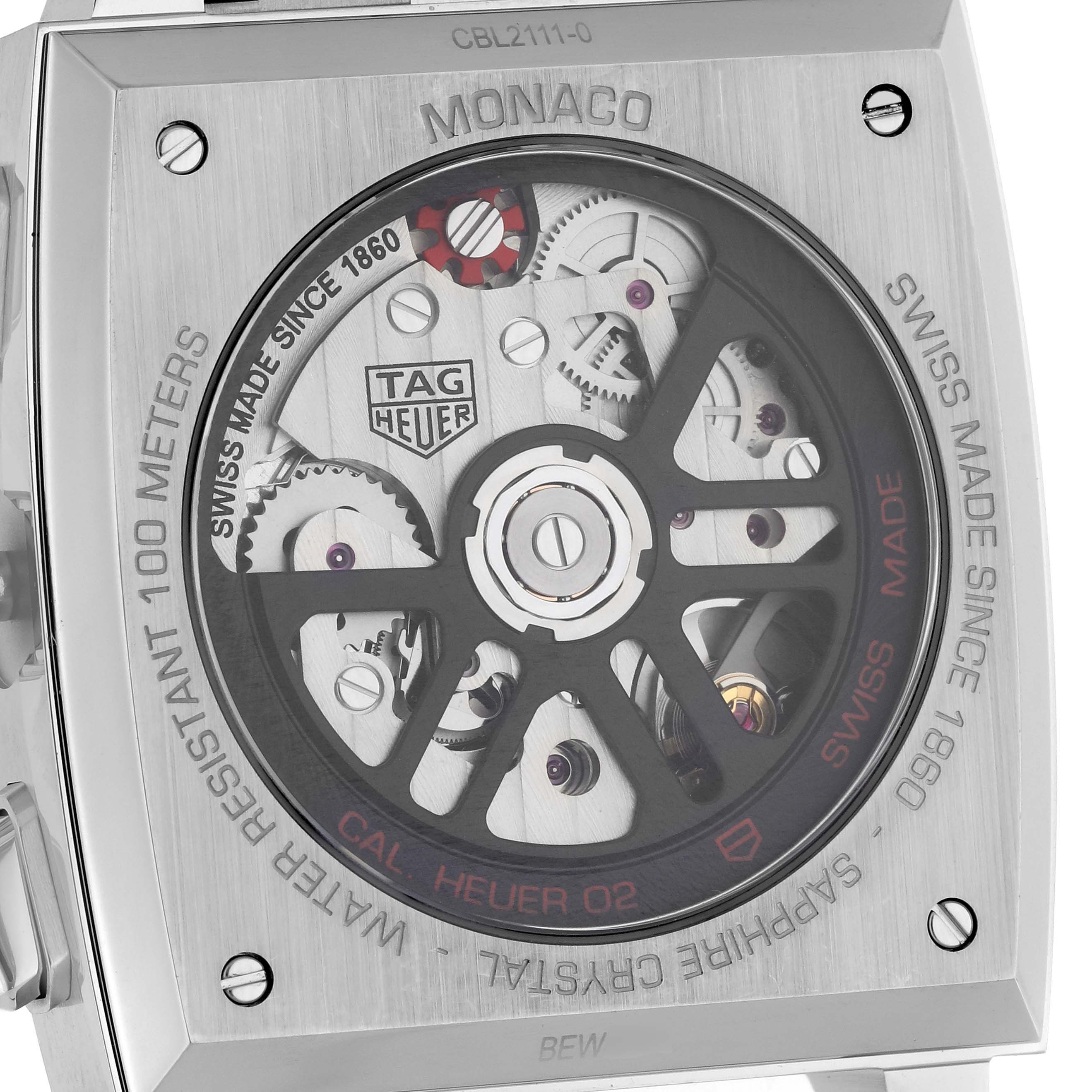 The image shows the back case of a Tag Heuer Monaco CBL2111.BA0644 Men's Stainless Steel Blue Dial CBL2111.BA0644 Men's Stainless Steel Blue Dial watch, revealing the internal mechanical parts and engravings.