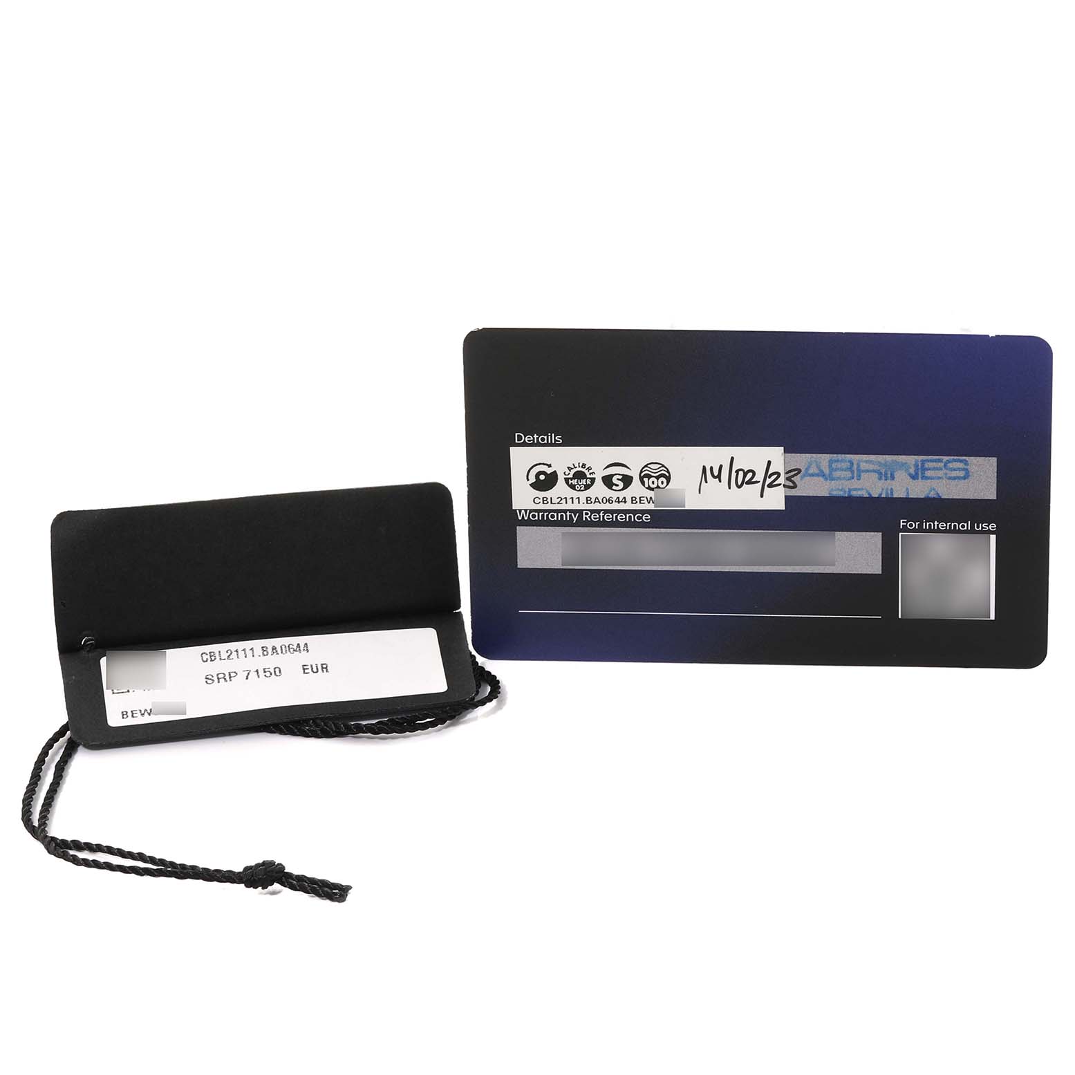 The image shows a Tag Heuer Monaco CBL2111.BA0644 Men's Stainless Steel Blue Dial CBL2111.BA0644 Men's Stainless Steel Blue Dial model warranty card and a price tag.