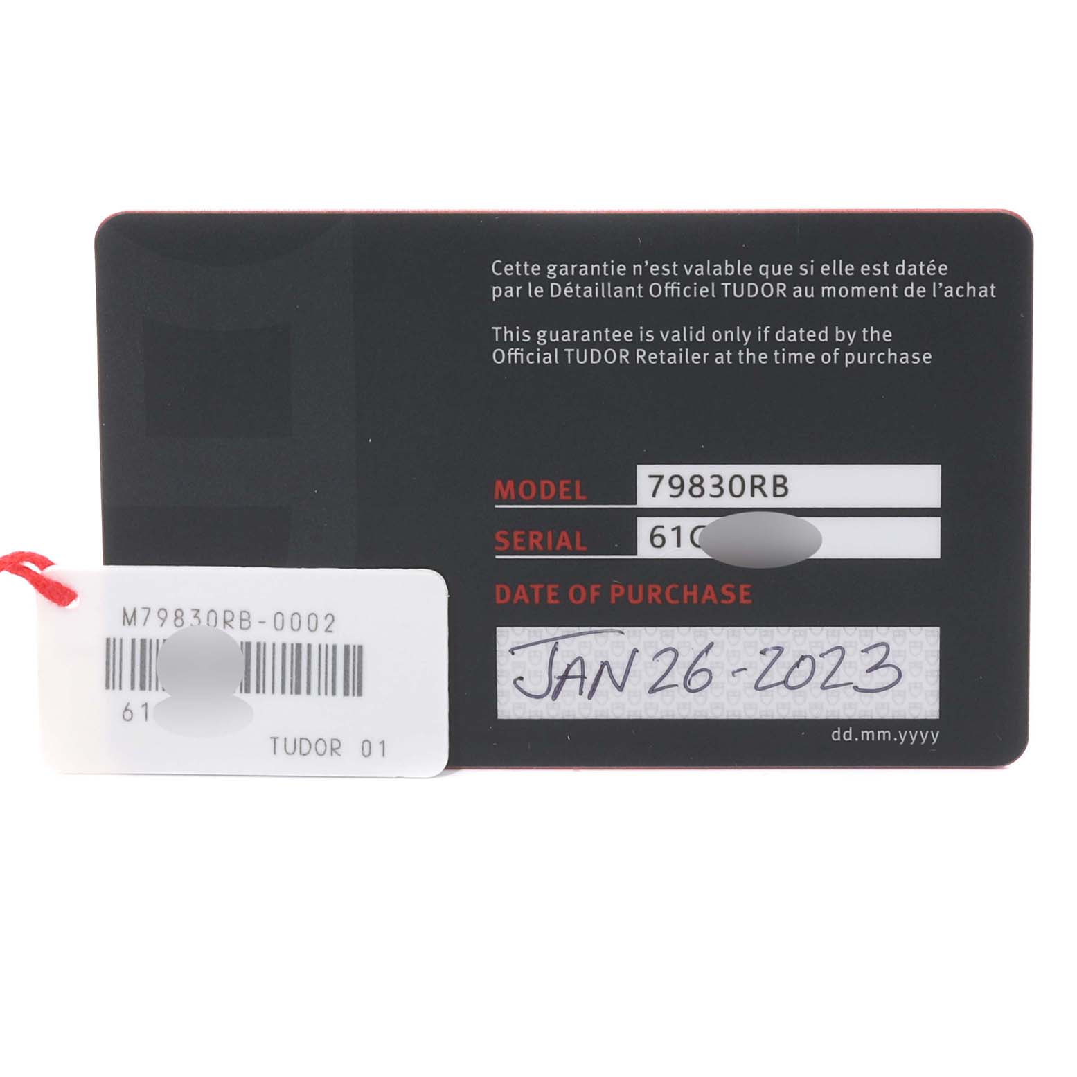 The image shows the warranty card for a Tudor Heritage Black Bay 79830RB Men
s Stainless Steel Black Dial 79830RB Men
s Stainless Steel Black Dial model watch, featuring the model number, serial number, and date of purchase.