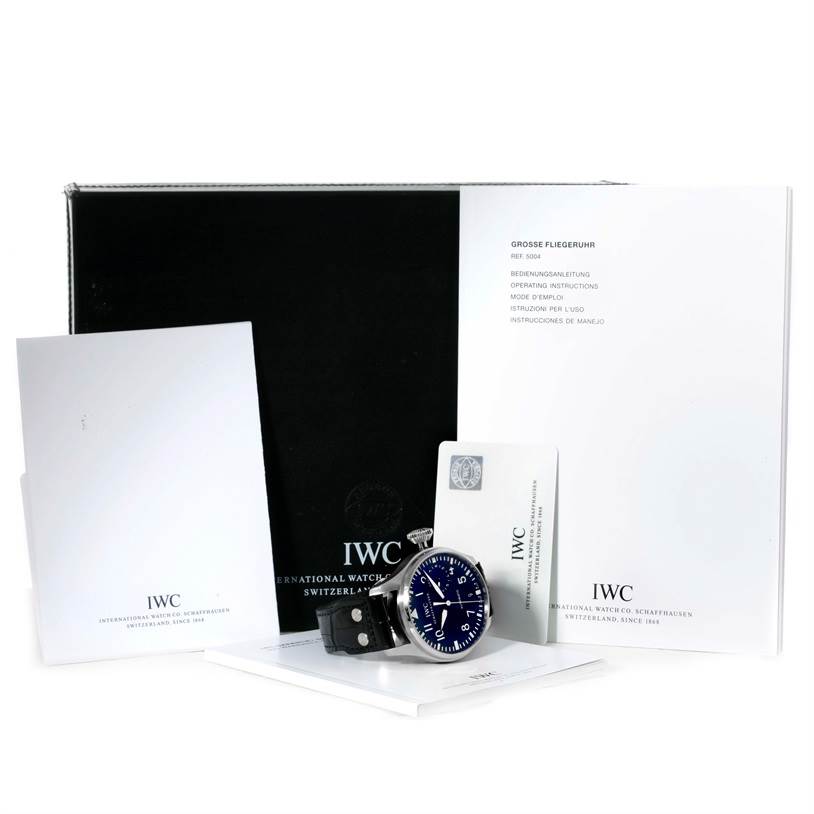The image shows the IWC Pilot IW500901 Men's Stainless Steel Black Dial IW500901 Men's Stainless Steel Black Dial watch and its accessories, including the watch box, documentation, and manuals, all displayed from a front angle.