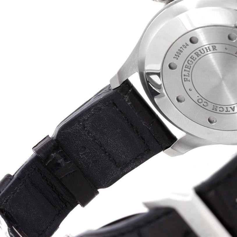 The image shows the back case and part of the leather strap of an IWC Pilot IW500901 Men's Stainless Steel Black Dial IW500901 Men's Stainless Steel Black Dial model watch.