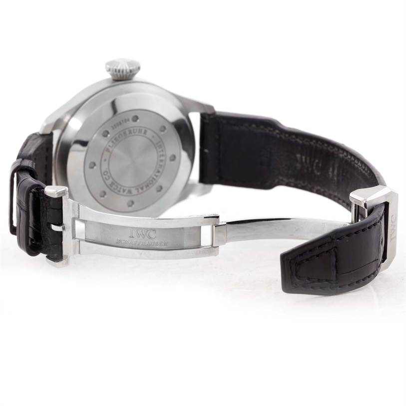 This image shows the back view of an IWC Pilot IW500901 Men's Stainless Steel Black Dial IW500901 Men's Stainless Steel Black Dial model watch with a partially open leather strap and clasp.