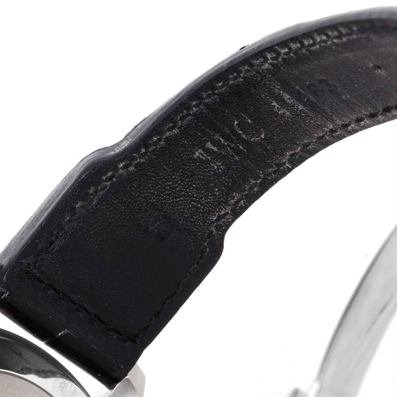 The image shows a close-up of the strap and a partial view of the case back of an IWC Pilot IW500901 Men's Stainless Steel Black Dial IW500901 Men's Stainless Steel Black Dial model watch.