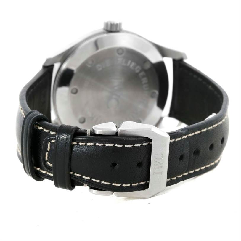 The image shows the back view of an IWC Pilot IW3253 Men's Stainless Steel Black Dial IW3253 Men's Stainless Steel Black Dial model watch, focusing on the case, leather strap, and buckle.