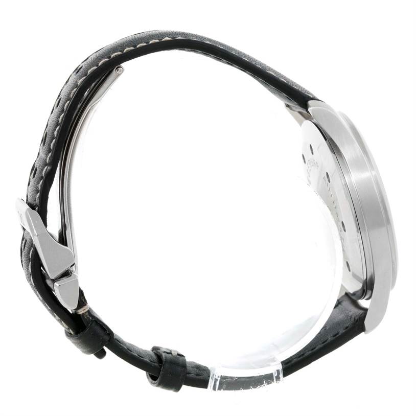 The image shows a side view of an IWC Pilot IW3253 Men's Stainless Steel Black Dial IW3253 Men's Stainless Steel Black Dial model watch, displaying the case, lugs, and leather strap with a clasp.