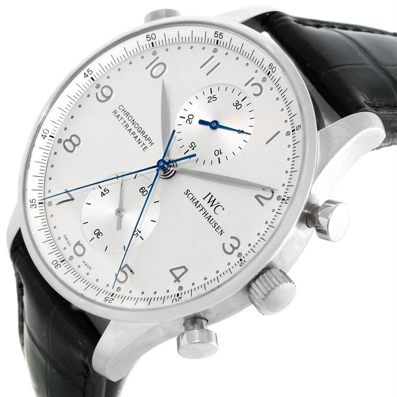 The image shows a three-quarter view of an IWC Portuguese IW371205 Men's Platinum Silver Dial IW371205 Men's Platinum Silver Dial chronograph, highlighting its dial, side buttons, and leather strap.