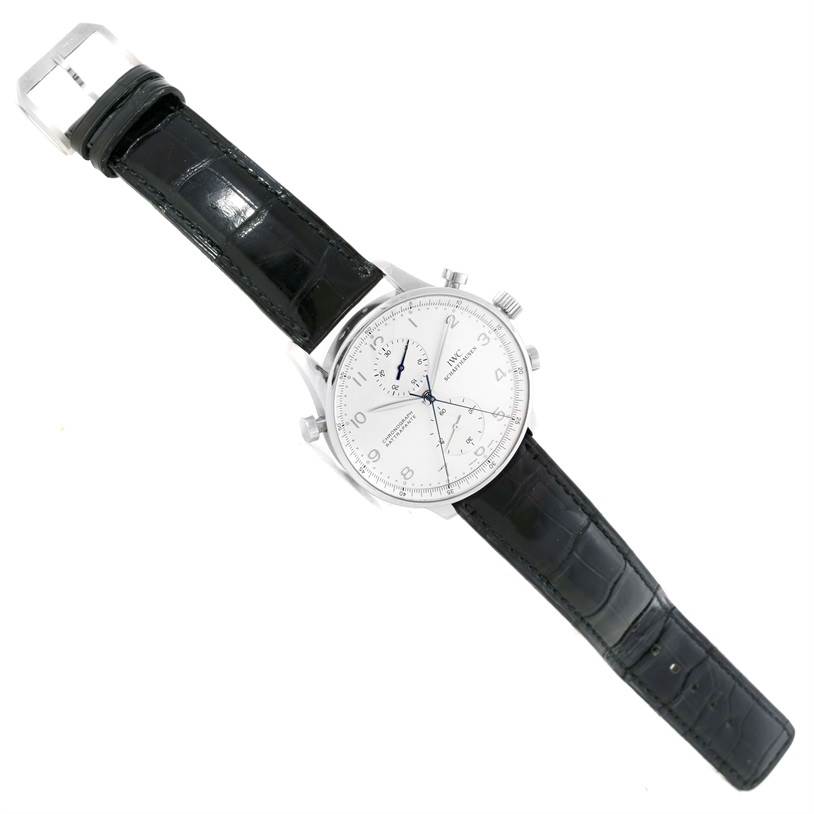 The image shows a full view of the IWC Portuguese IW371205 Men's Platinum Silver Dial IW371205 Men's Platinum Silver Dial model watch, including the face, case, crown, pushers, and leather strap.