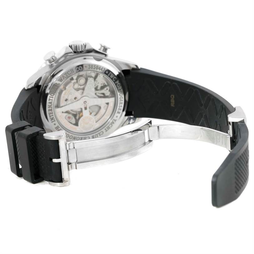 The image shows the back of the IWC Portuguese IW390210 Men's Stainless Steel Black Dial IW390210 Men's Stainless Steel Black Dial watch, revealing its inner mechanical parts and black rubber strap with a clasp.