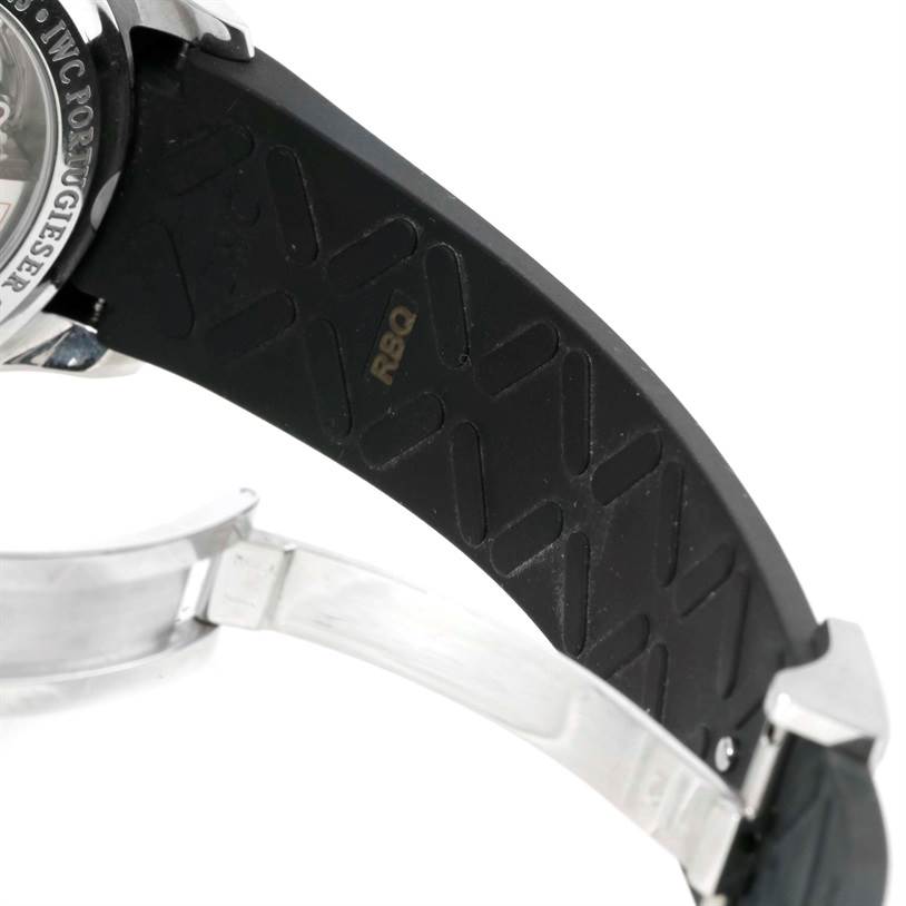 The image shows the backside of the IWC Portuguese IW390210 Men's Stainless Steel Black Dial IW390210 Men's Stainless Steel Black Dial watch, focusing on the rubber strap and metal clasp.