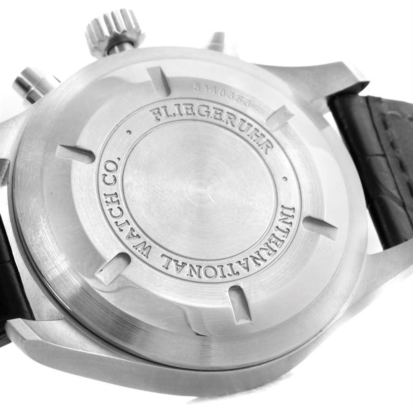 The image shows the case back and crown of the IWC Pilot IW377701 Men's Stainless Steel Black Dial IW377701 Men's Stainless Steel Black Dial model watch from a close-up angle.