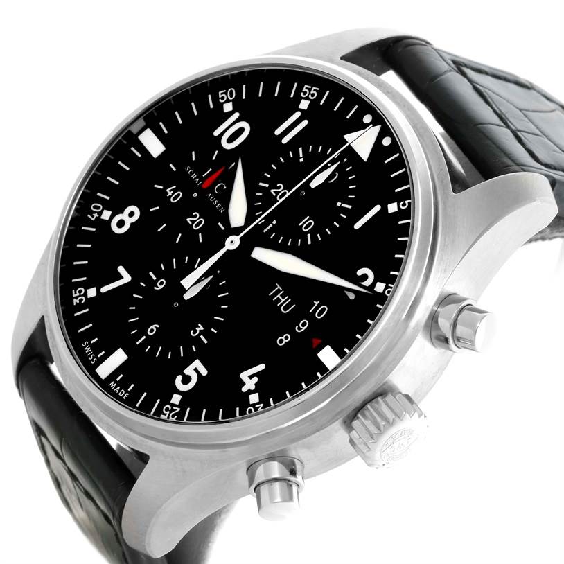 The image shows a close-up of an IWC Pilot IW377701 Men's Stainless Steel Black Dial IW377701 Men's Stainless Steel Black Dial model watch highlighting the dial, crown, pushers, and part of the strap.