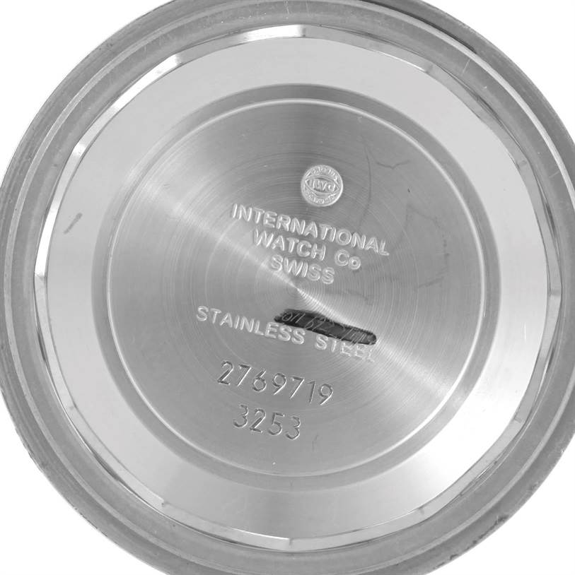 This image shows the interior case back of an IWC Pilot IW325301 Men's Stainless Steel Black Dial IW325301 Men's Stainless Steel Black Dial watch, displaying engravings and serial numbers.