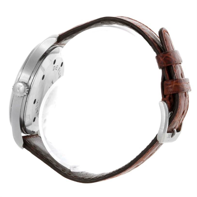 This image shows the side view of the IWC Pilot IW325301 Men's Stainless Steel Black Dial IW325301 Men's Stainless Steel Black Dial model watch, highlighting the crown, casing, and leather strap.