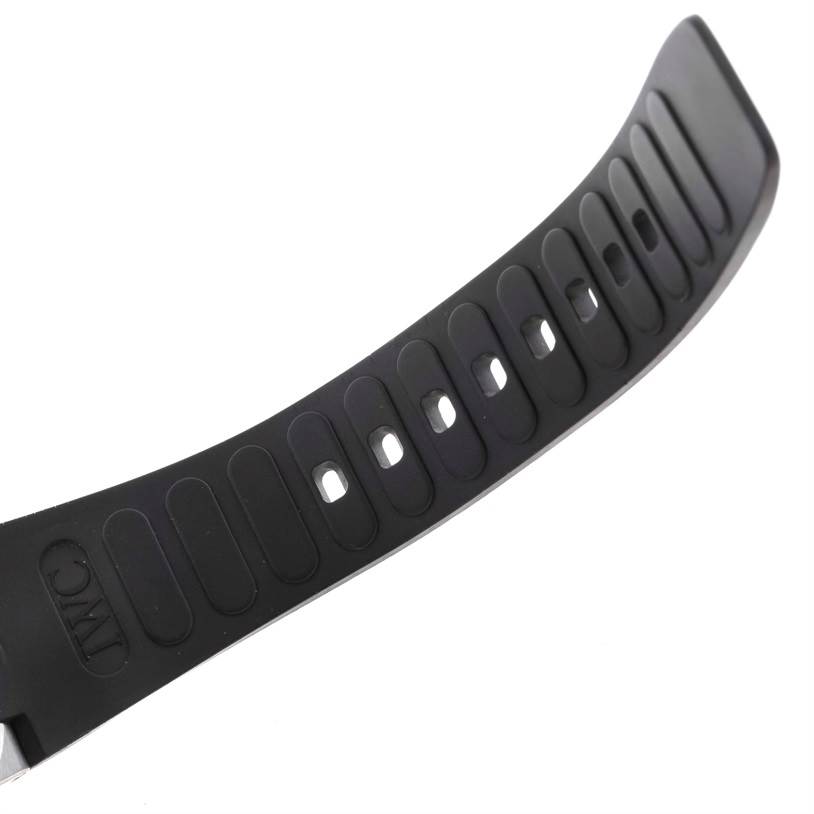 This image shows a close-up view of the black rubber strap for the Aquatimer model by IWC, focusing on the perforated holes and IWC branding.