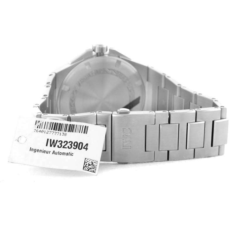 The image shows the back and bracelet of the IWC Ingenieur IW323904 Men's Stainless Steel Silver Dial IW323904 Men's Stainless Steel Silver Dial model IW323904 watch, with the label tag attached.