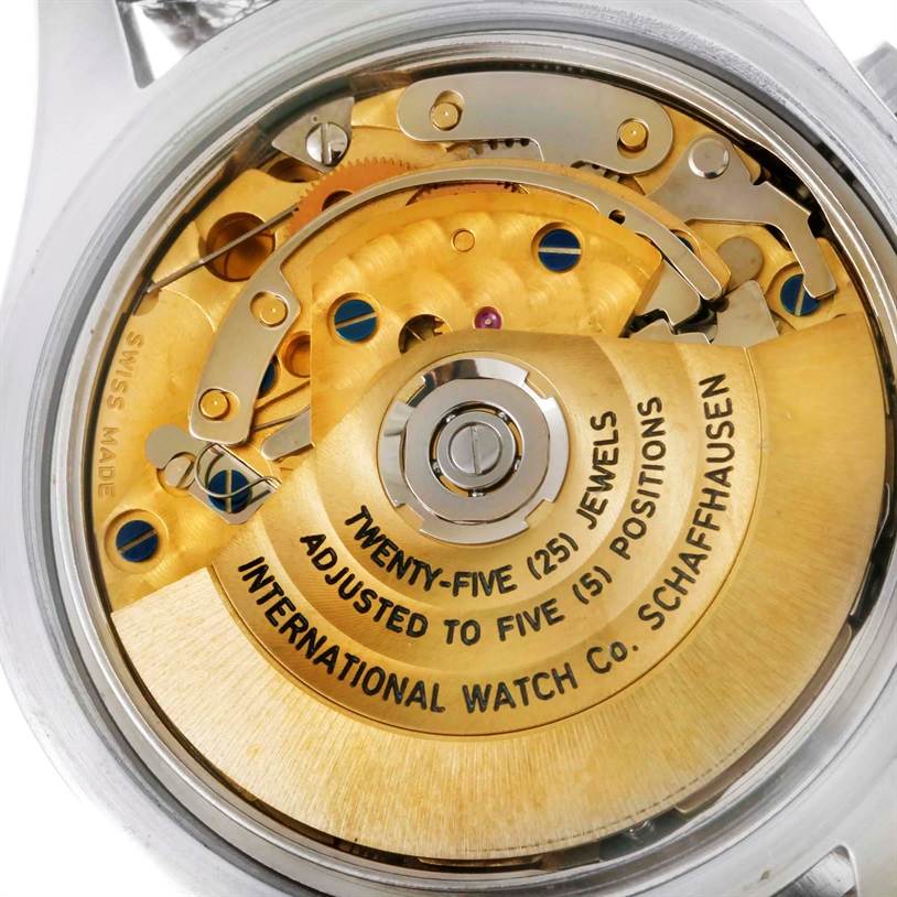 This image shows the back view of the IWC Pilot IW325110 Men's Stainless Steel Silver Dial IW325110 Men's Stainless Steel Silver Dial watch revealing its intricate internal mechanical components and rotor.