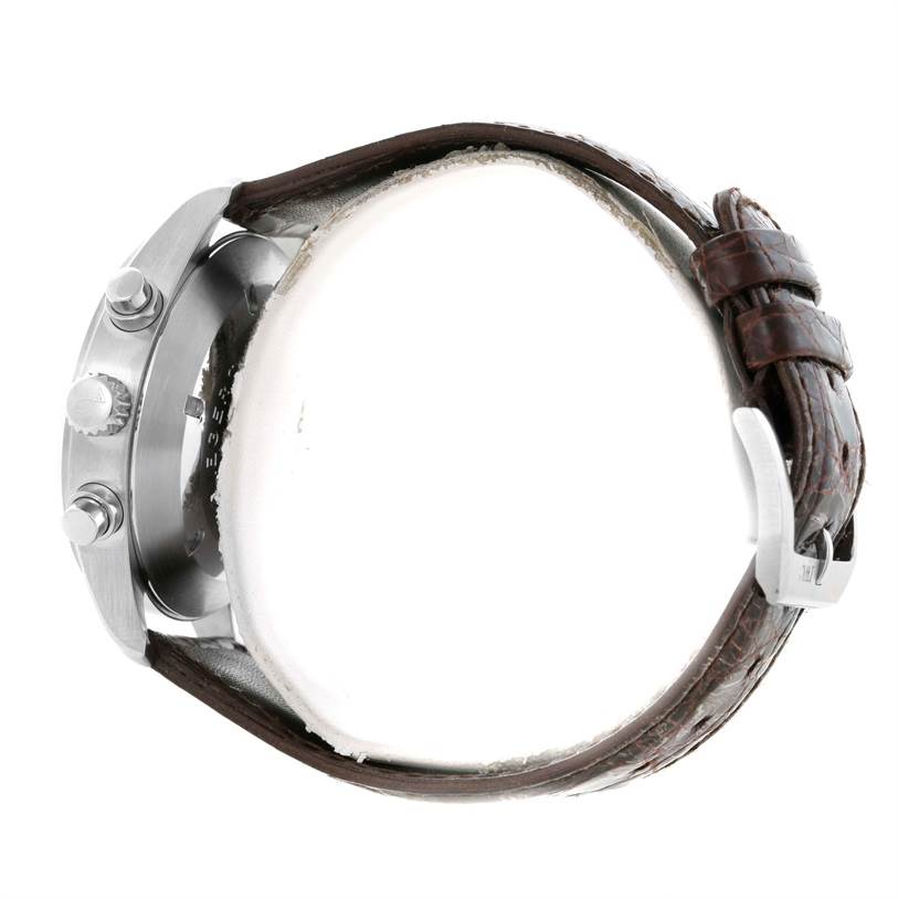 The image shows a side profile of an IWC Pilot IW325110 Men's Stainless Steel Silver Dial IW325110 Men's Stainless Steel Silver Dial model watch, highlighting the case, crown, pushers, and leather strap.