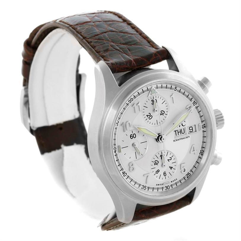 This image shows an angled side view of the IWC Pilot IW325110 Men's Stainless Steel Silver Dial IW325110 Men's Stainless Steel Silver Dial model watch, highlighting the dial, case, and a portion of the leather strap.