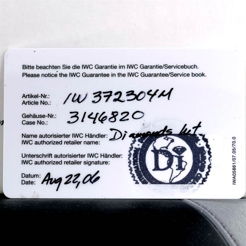 The image shows a close-up of the warranty card for an IWC Aquatimer IW372304 Men's Titanium Black Dial IW372304 Men's Titanium Black Dial watch, detailing the article and case numbers.