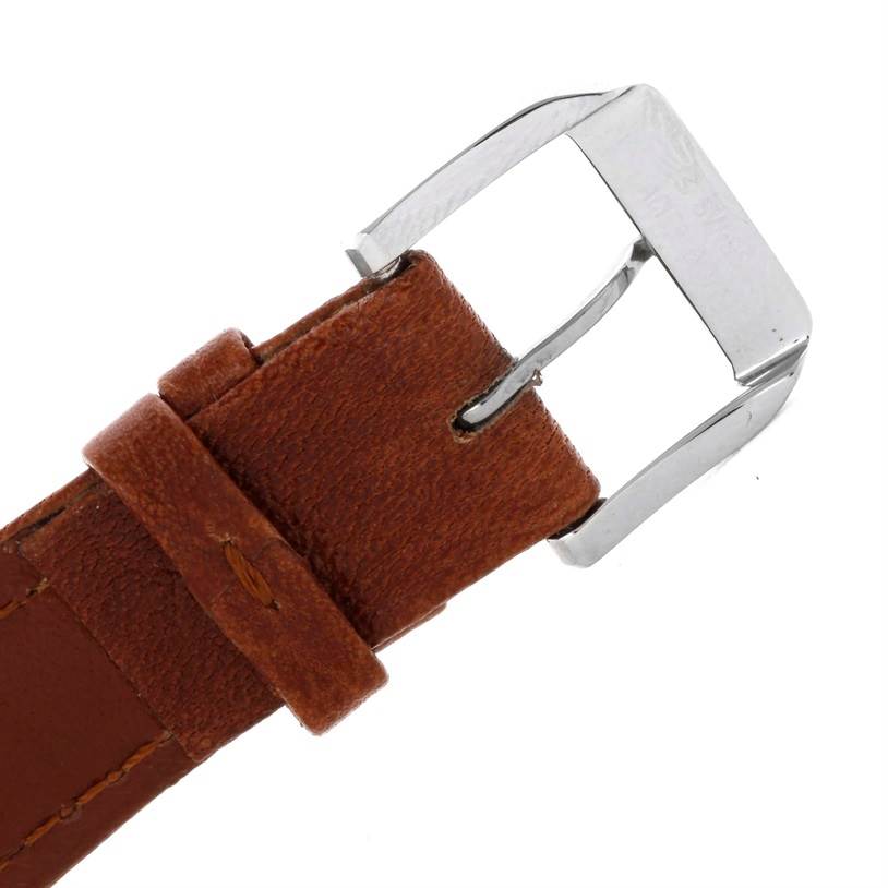 This image shows a close-up view of the buckle and leather strap of an IWC Pilot IW325602 Men's Stainless Steel Silver Dial IW325602 Men's Stainless Steel Silver Dial watch.