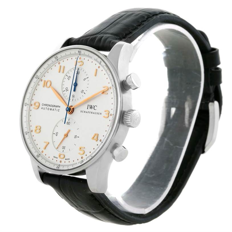 This IWC Portuguese IW371401 Men's Stainless Steel Silver Dial IW371401 Men's Stainless Steel Silver Dial model watch is shown at a slight angle highlighting the face, crown, pushers, and black leather strap.