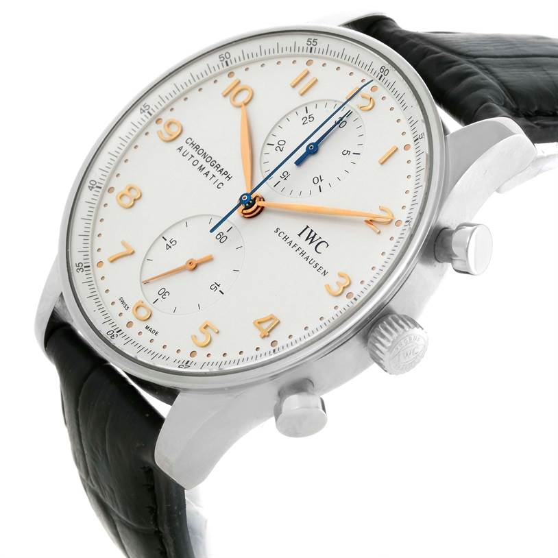 The image shows a side angle of an IWC Portuguese IW371401 Men's Stainless Steel Silver Dial IW371401 Men's Stainless Steel Silver Dial model watch, highlighting the crown, pushers, dial, and part of the leather strap.