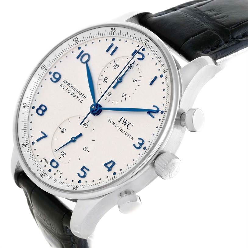 The image shows a side angle view of the IWC Portuguese IW371417 Men's Stainless Steel Silver Dial IW371417 Men's Stainless Steel Silver Dial Chronograph watch, highlighting its dial, crown, and pushers.