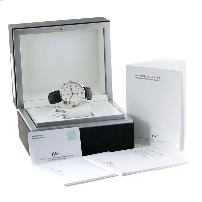 The image shows an IWC Portuguese IW371417 Men's Stainless Steel Silver Dial IW371417 Men's Stainless Steel Silver Dial model watch from a front angle, with its box, warranty, and instruction booklets.