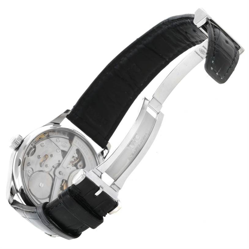 The photo shows the back case and the deployment clasp of the IWC Portuguese IW500109 Men's Stainless Steel Black Dial IW500109 Men's Stainless Steel Black Dial watch, angles showing the movement and leather strap.