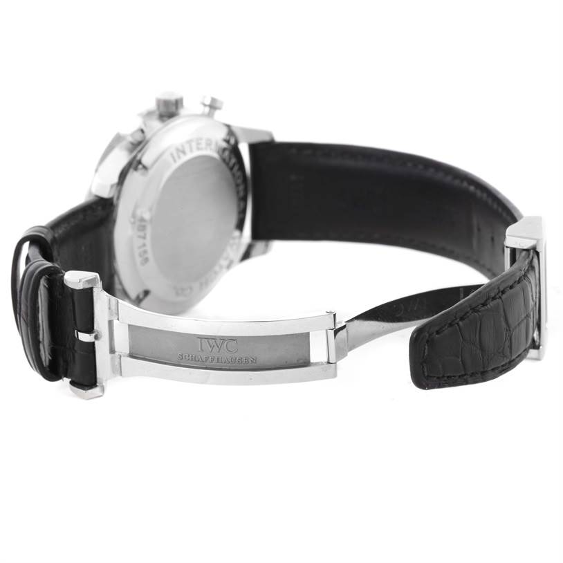 The image shows the back and partially open clasp of an IWC Portuguese IW371447 Men's Stainless Steel Black Dial IW371447 Men's Stainless Steel Black Dial model watch with a black leather strap.